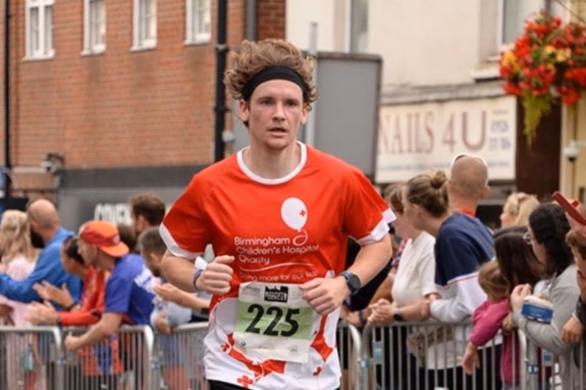 Man running race in BCH top