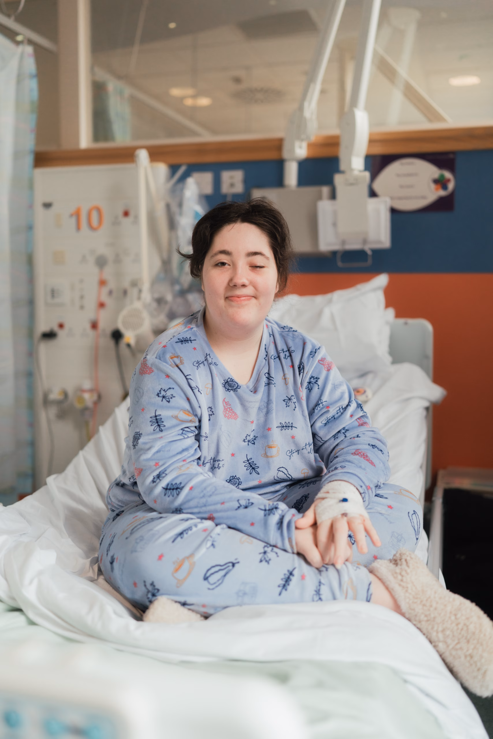 patient sitting on bed in hospital
