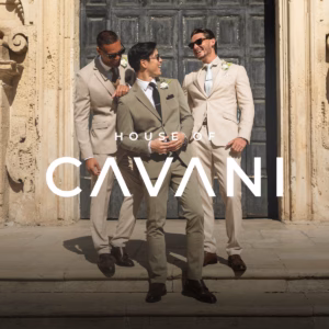Three men wearing suits laughing