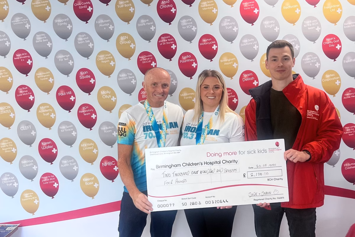 Jason Hewitt (left), Jade Hewitt (centre) and Will Graves (right) holding giant fundraising cheque