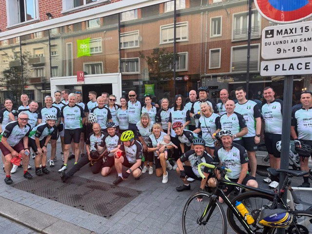 Smiling cyclists in racing gear
