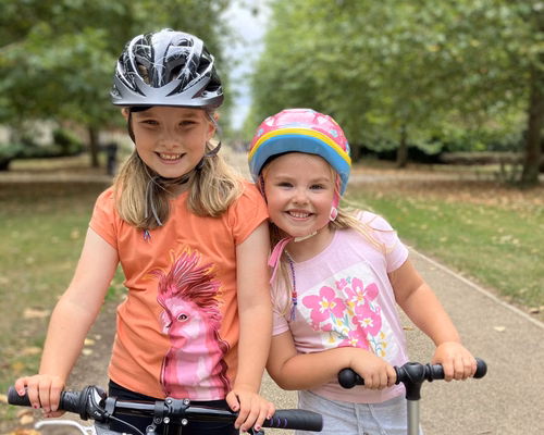Two young girls on bikes