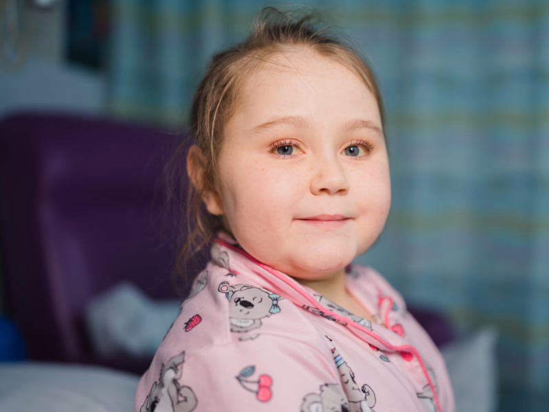 young girl smiling in hospital