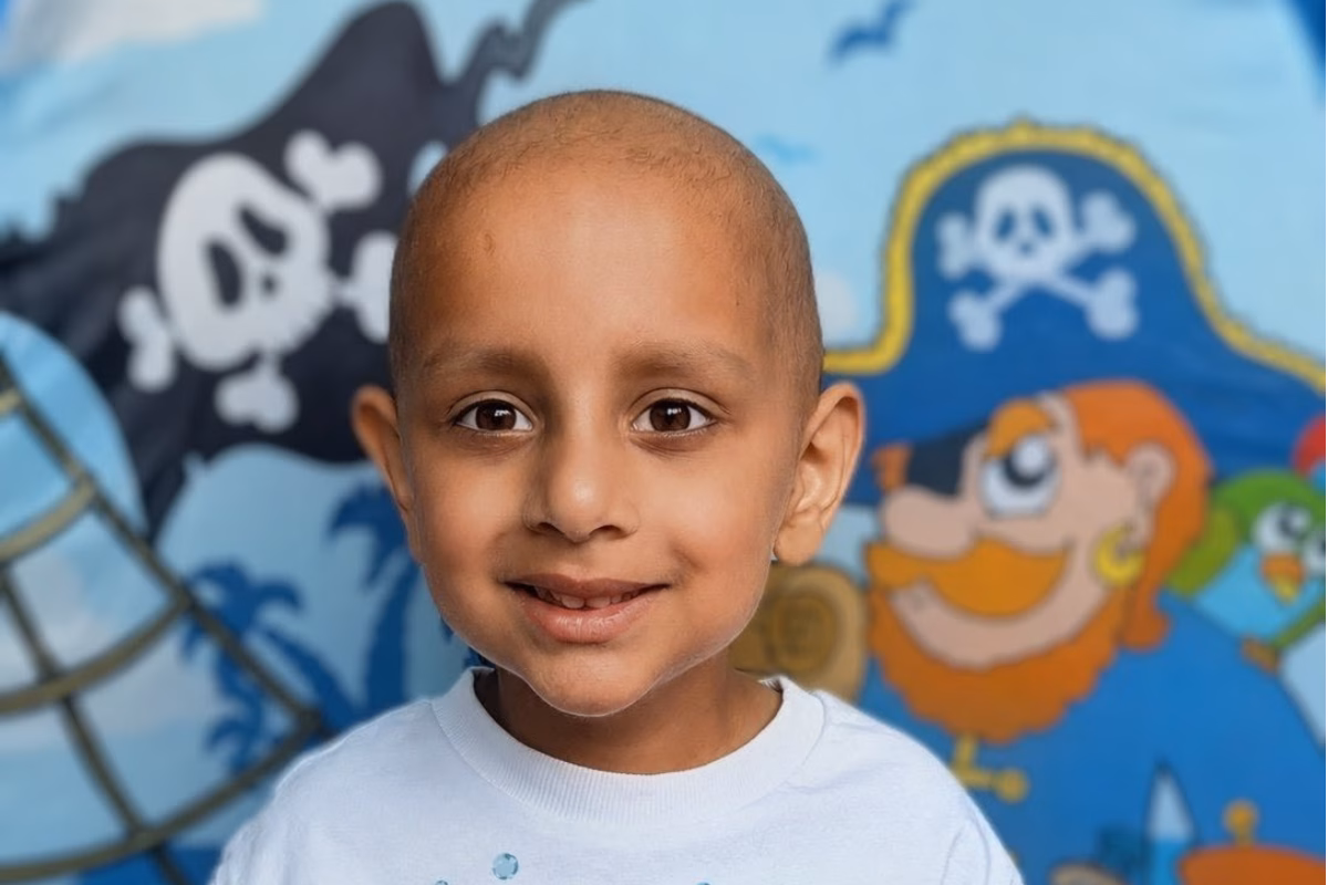 Young boy with pirate tent background