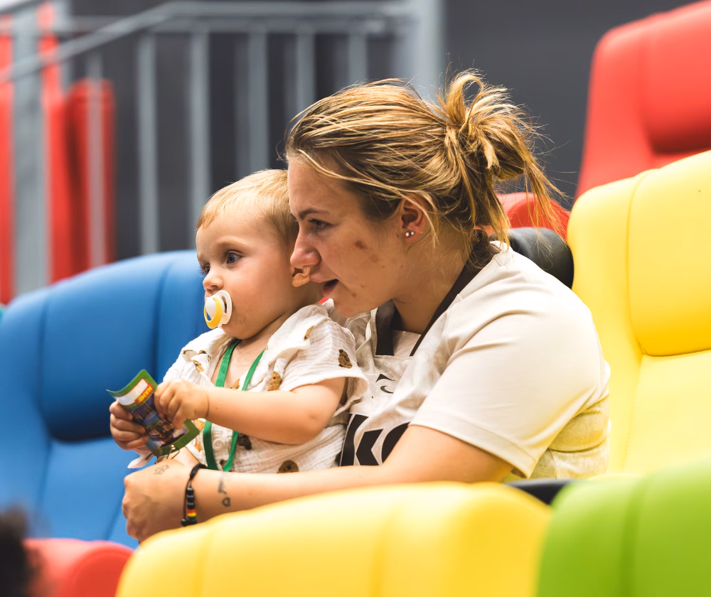 Mum and boy on cinema seats watching film