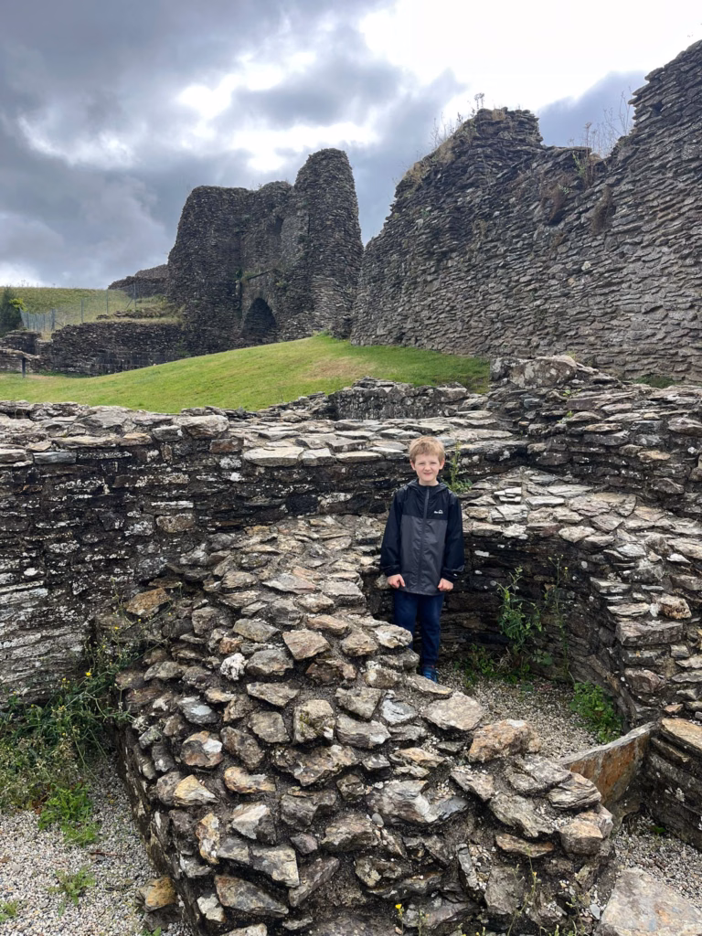 Mason standing in castle ruins