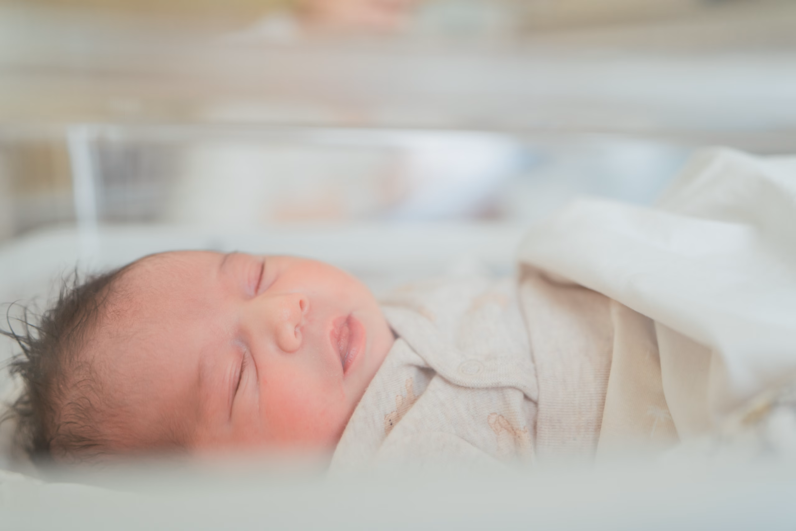 sleeping baby in cot in the hospital