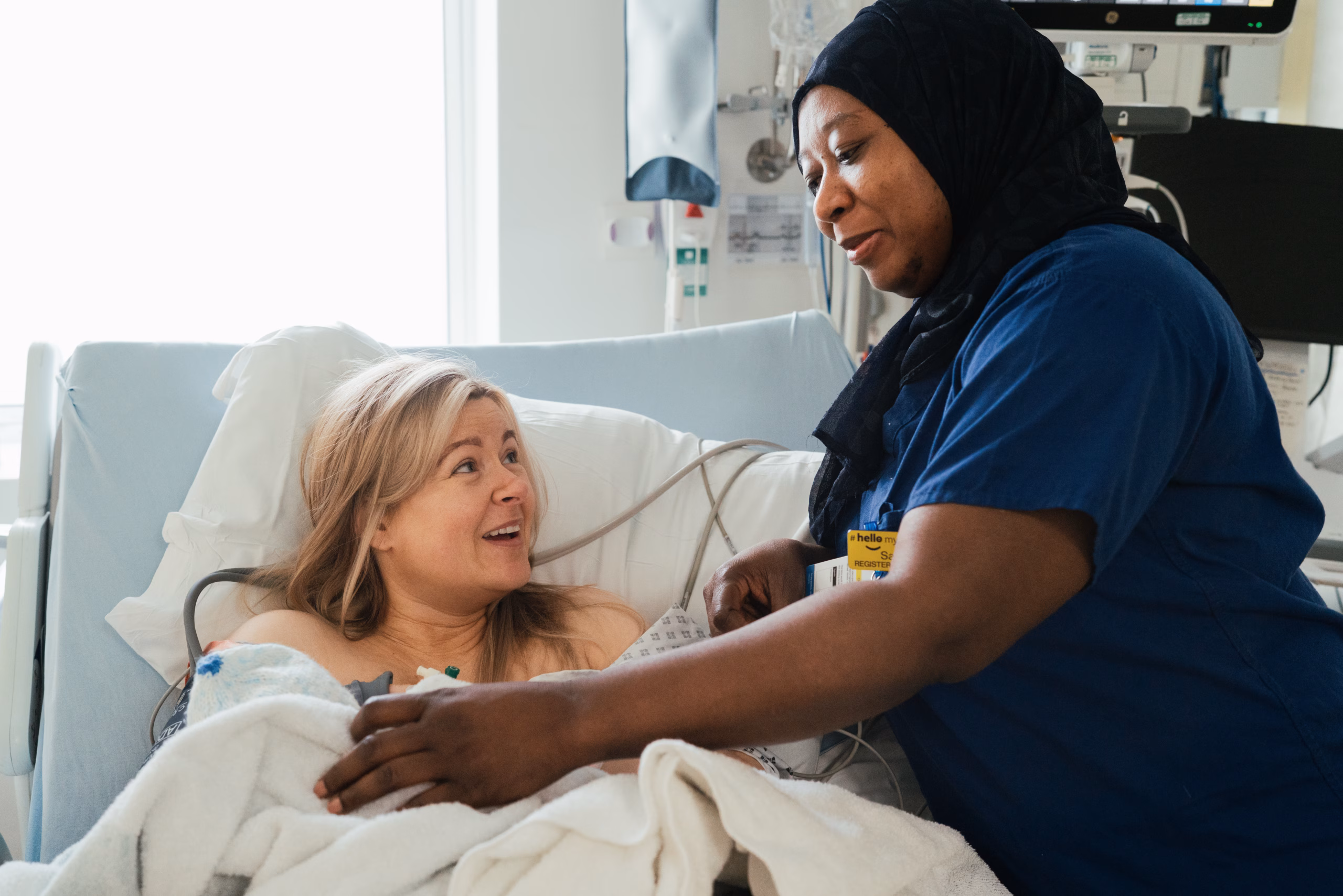 Midwife looking after a newborn baby and mother