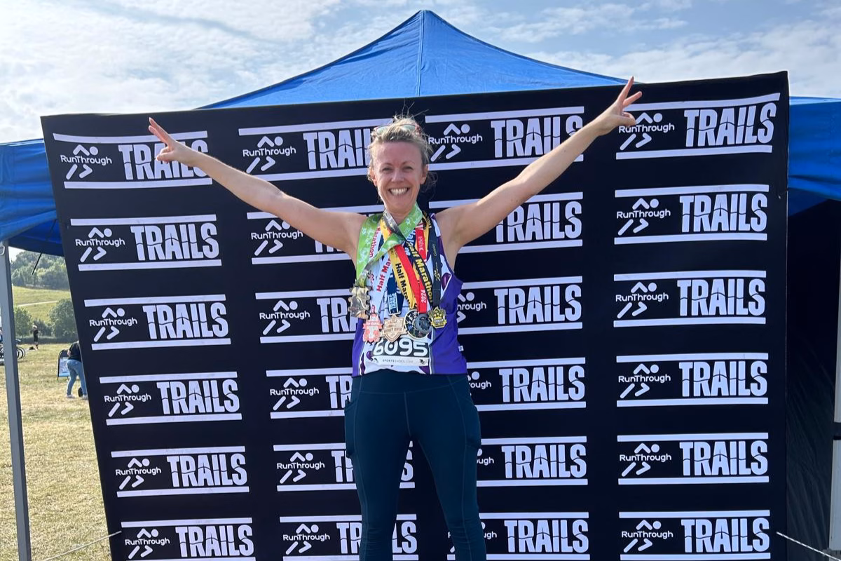 Anna Cosgrove celebrating her sixth half marathon with six medals