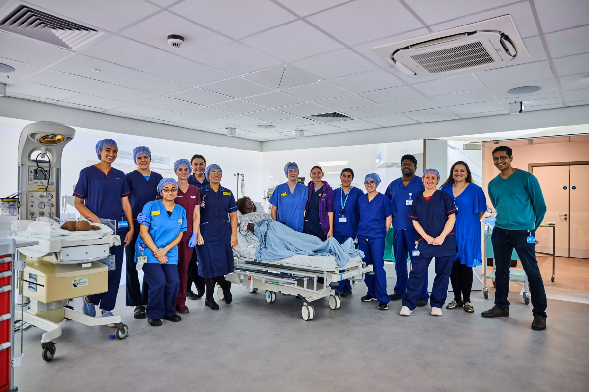 Clinical team standing in sim lab