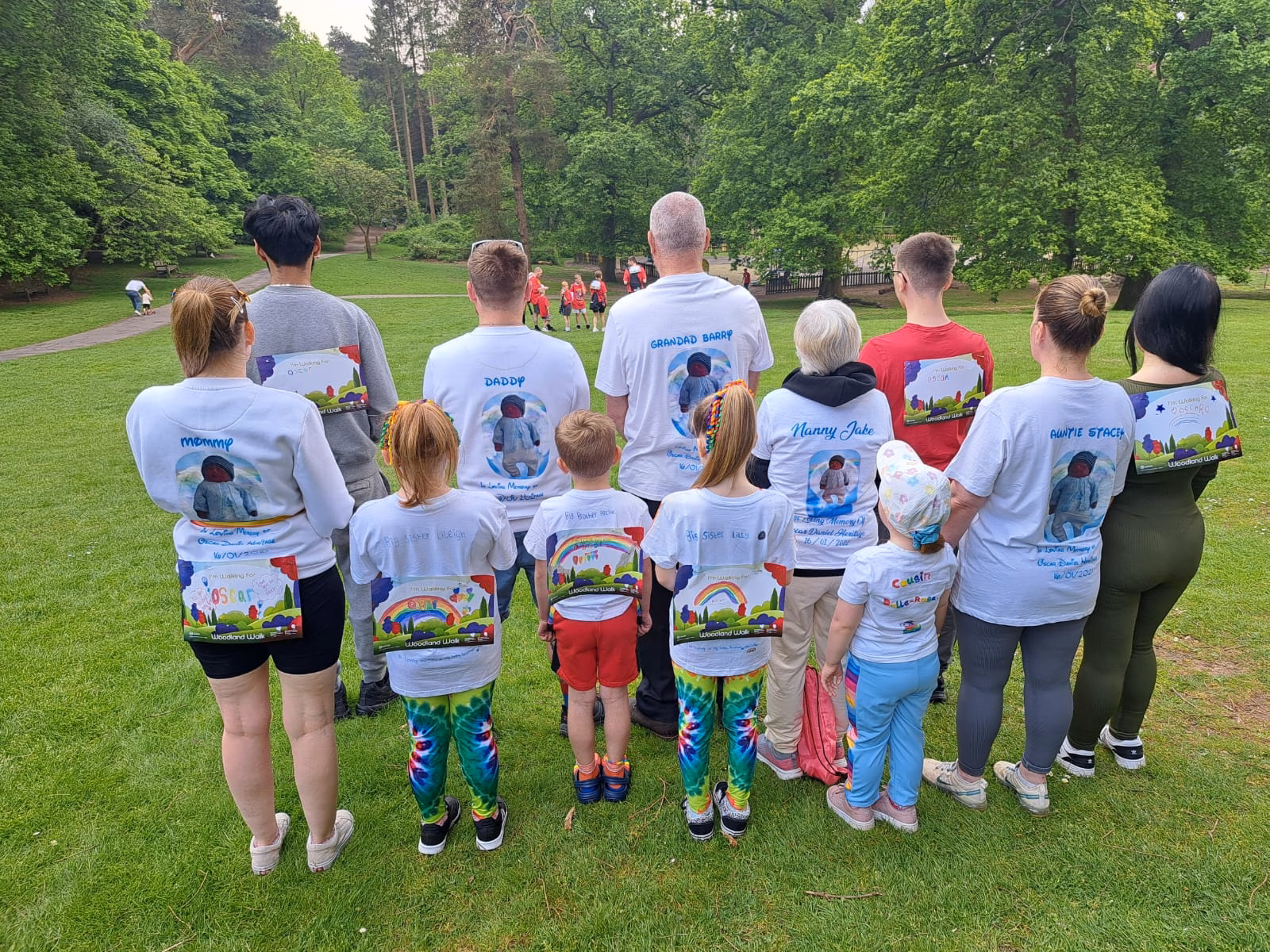 Laura, Ross and family wearing memorial T-shirts for baby Oscar