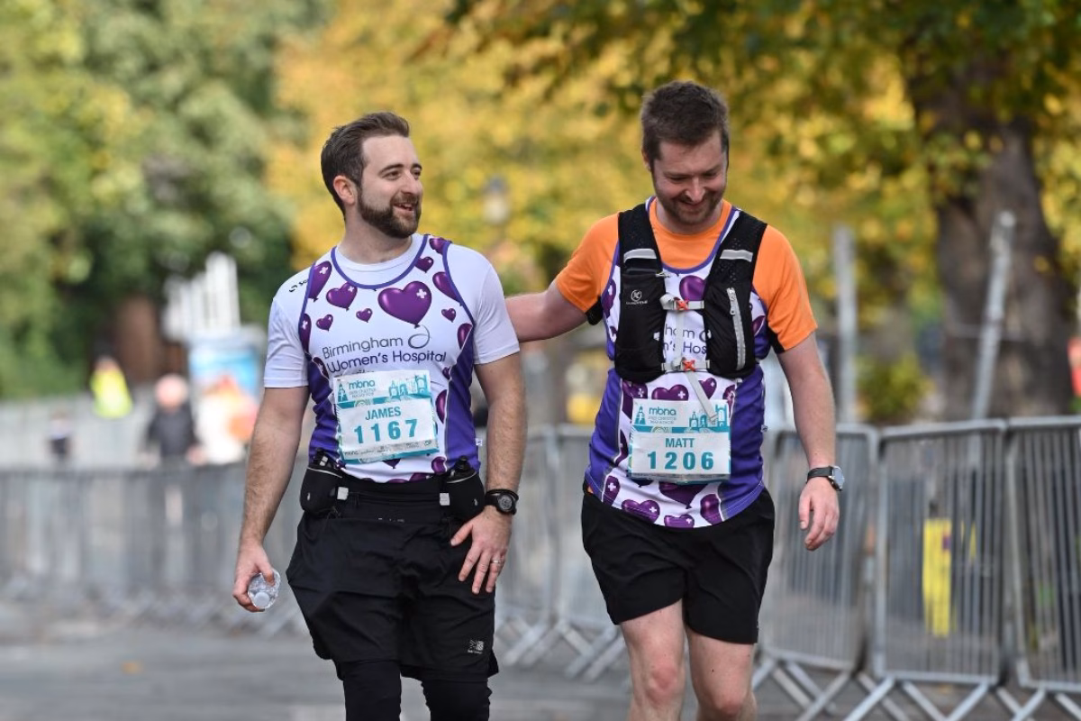 James Lindop in charity running gear with his cousin and fellow runner