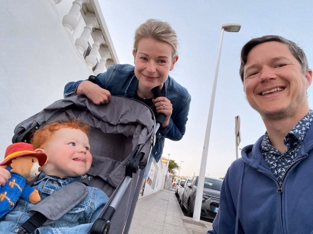 Mum Adele and Dad Daniel with their son, Louis, in a pushchair