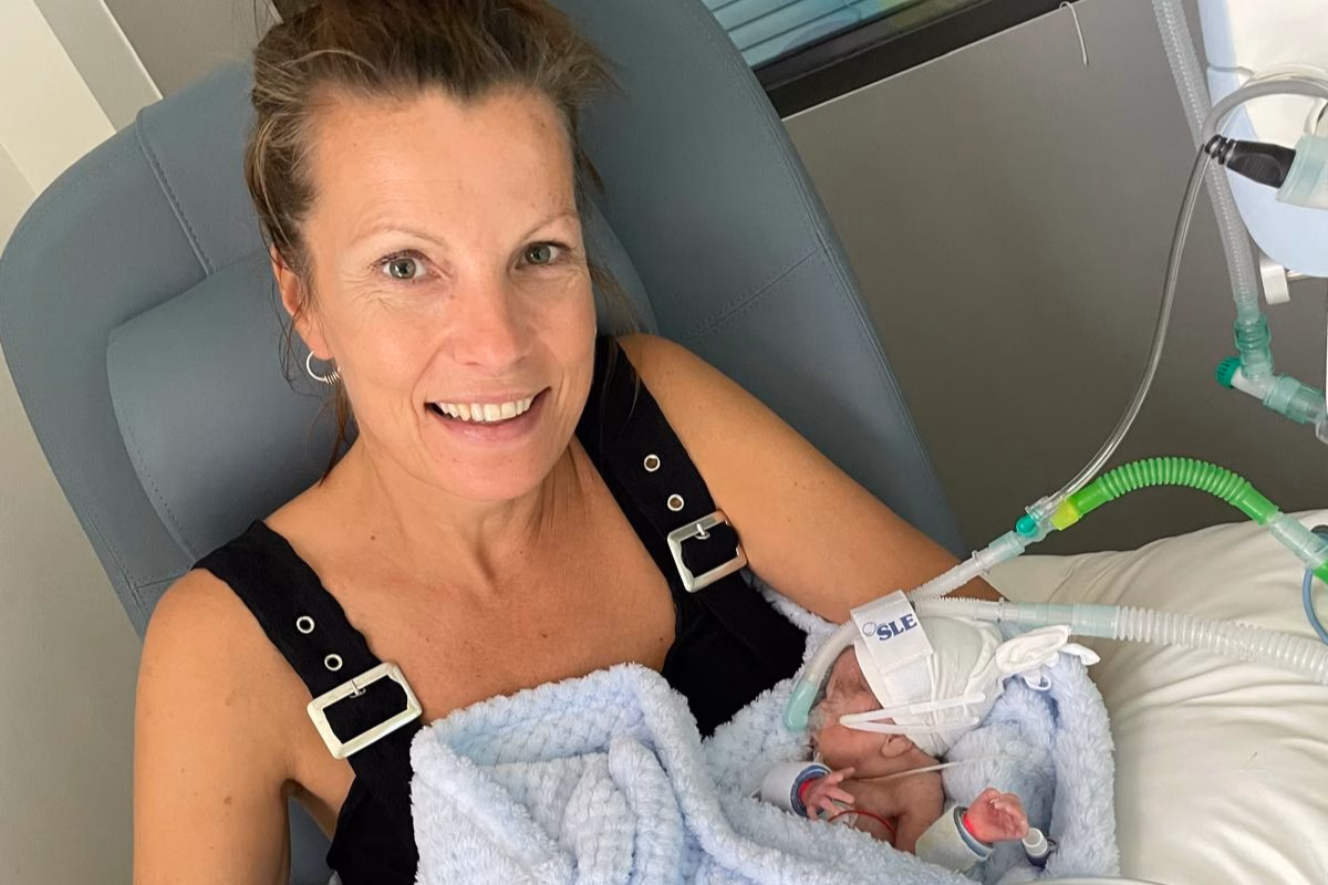 Mum Sarah Greenow holding baby, Monty
