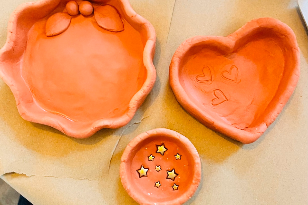 Handmade clay bowls with hearts and stars